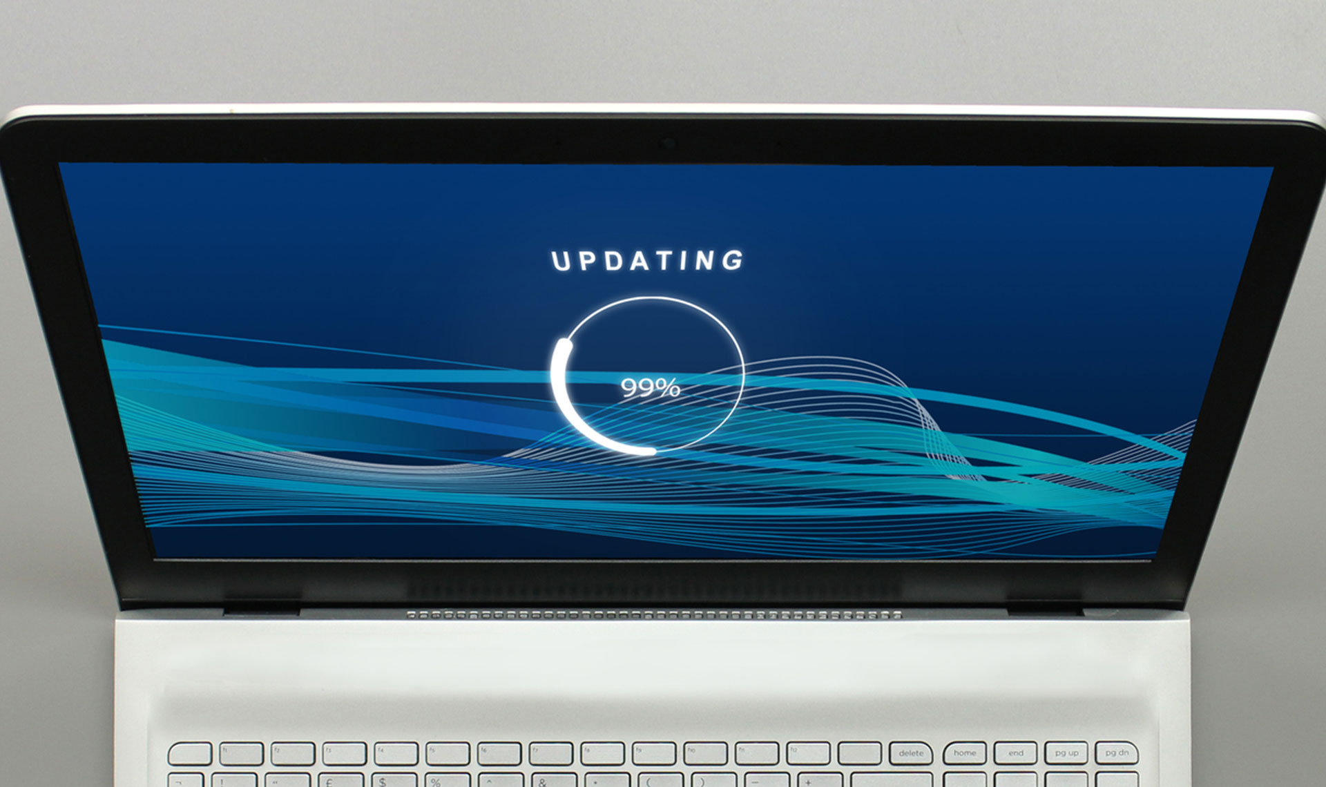 Laptop showing 99% update icon