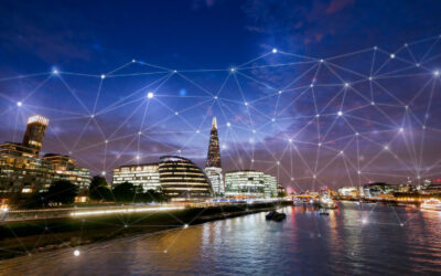 London skyline at dusk with digital network overlay, symbolizing IT asset management and connectivity in the tech industry.