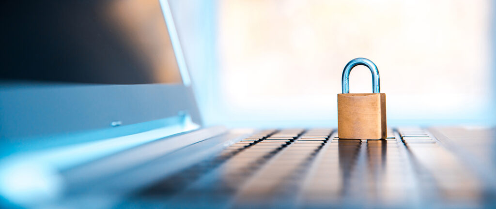 Digital security concept showing a padlock on a laptop screen, symbolising the need for secure data disposal and protection of sensitive business information