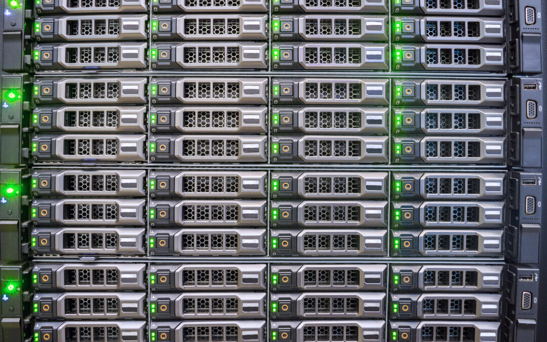 Server racks with illuminated indicators, representing secure IT asset disposal and data management services by Astralis Technology.