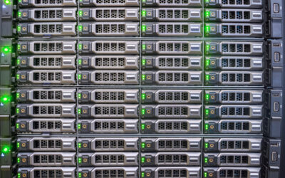 Server racks with multiple hard drives, illuminated green indicators, representing IT asset management and sustainability in technology.