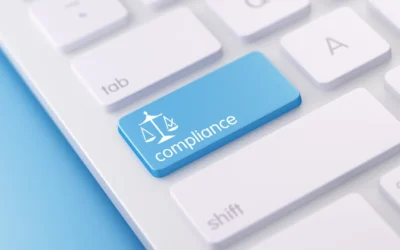 Blue keyboard key labeled "compliance" with scales icon, symbolizing IT asset disposal regulations and standards relevant to GDPR and NIST 800-88 compliance.