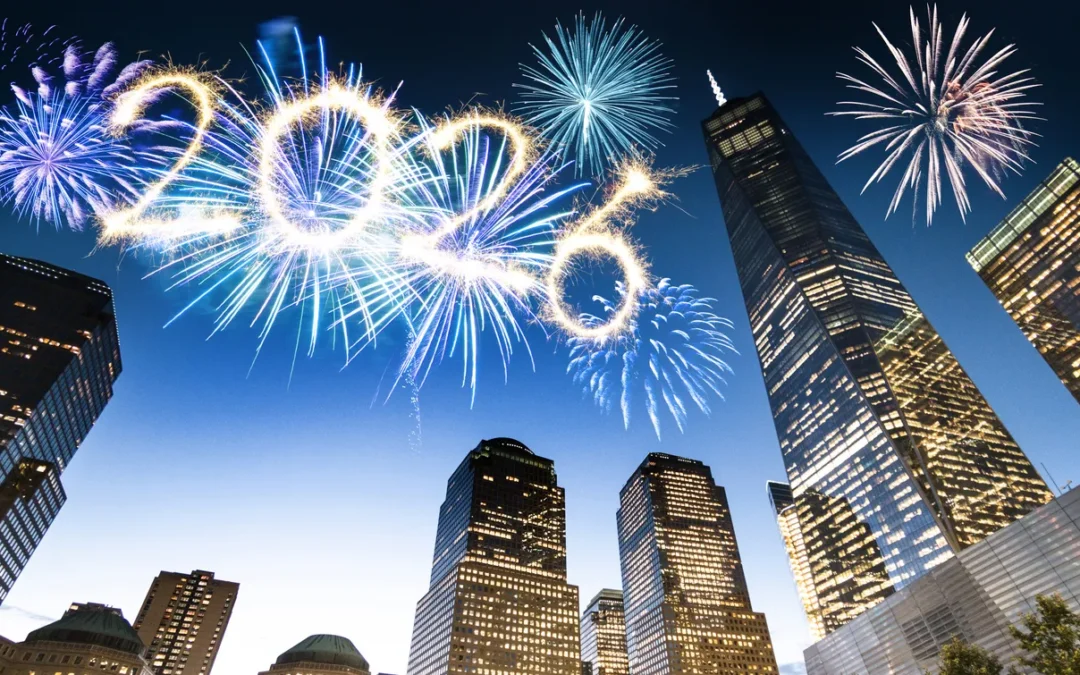 Fireworks illuminating the night sky with the year "2026" above a city skyline featuring tall buildings, symbolizing celebration and new beginnings in data protection and compliance.