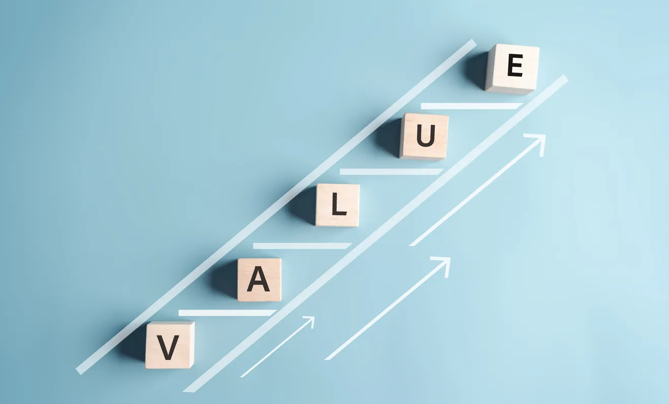 Blocks spelling "VALUE" on an upward trajectory with arrows, symbolizing value recovery in server disposal processes.