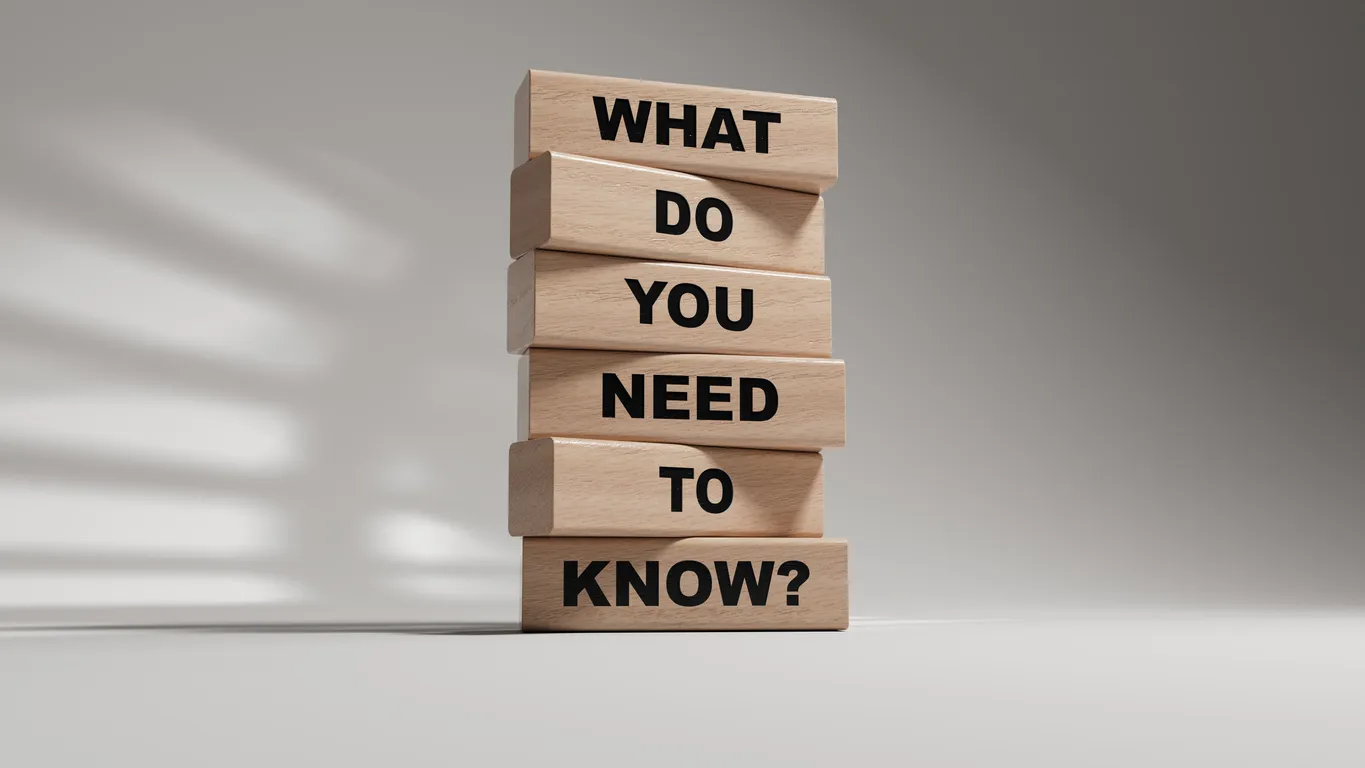 Wooden blocks stacked with the phrase "WHAT DO YOU NEED TO KNOW?" emphasizing guidance for secure data centre relocation planning.